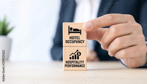 Business professional analyzing hotel occupancy and hospitality performance with wooden blocks on a desk
