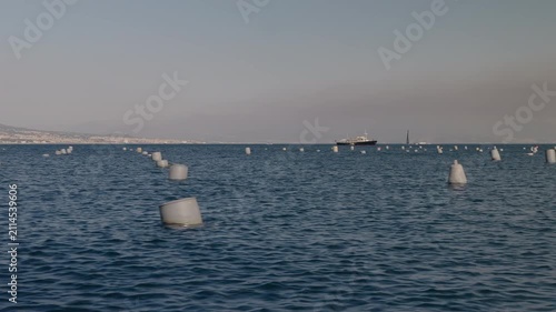 A boat harvesting mussels from a farm in the Gulf of Naples along the Mediterranean coast.