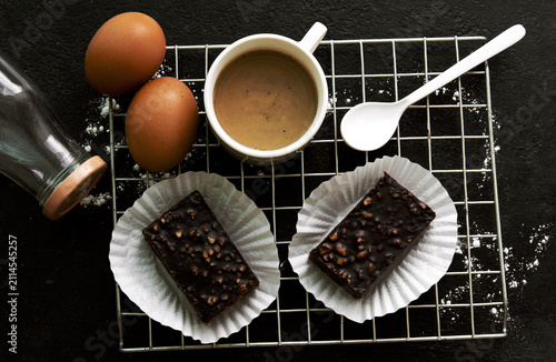 delicious homemade chocolate brownies  , arranged on wire cooling rack. Taken on a white background.