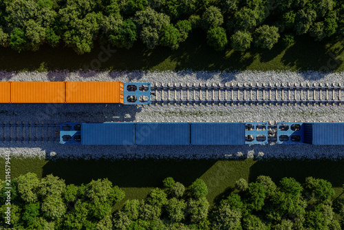 Aerial view of freight train carrying cargo containers through green forest, global cargo transportation