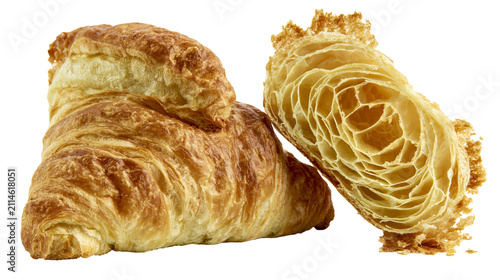 фотографія Golden brown croissants, one whole and one cut in half showing flaky layers