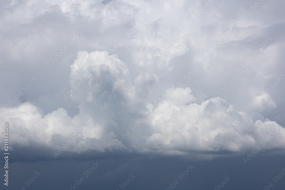 Fototapeta premium Towering storm clouds before rainfall with dramatic overcast sky