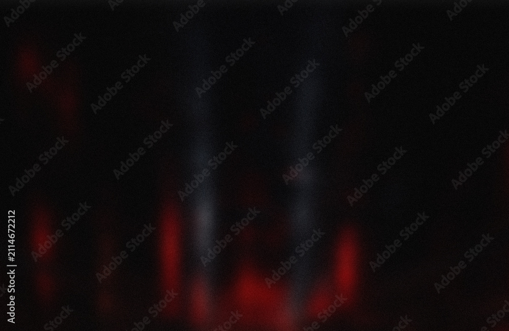 Naklejka premium Red light beams in dark space
