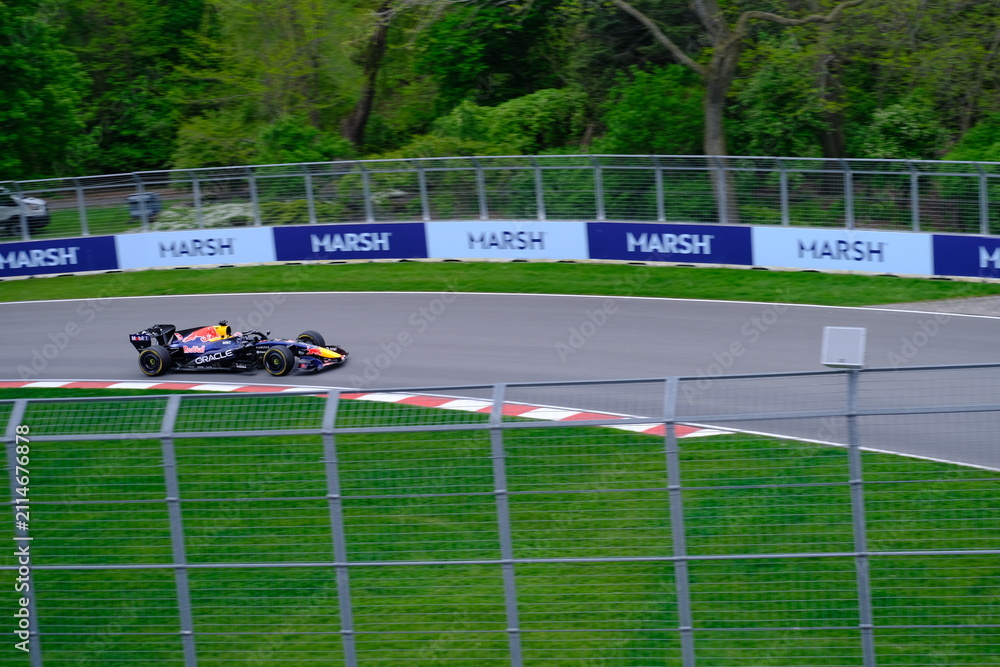 Fototapeta premium May 24, 2025, Montreal, Canada: Red Bull Racing Formula 1 car during by Hadjar or Verstappen, demonstration run at Circuit Gilles Villeneuve. g.