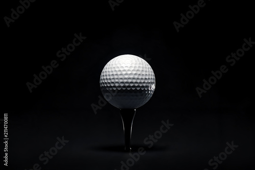 Golf ball close-up on tee dark background studio lighting minimal composition detailed texture