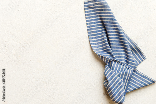top view with blue kitchen napkin isolated on table background. Folded cloth for mockup with copy space, Flat lay. Minimal style