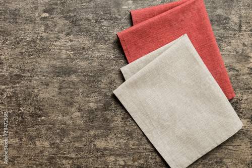 top view with gray kitchen napkin isolated on table background. Folded cloth for mockup with copy space, Flat lay. Minimal style