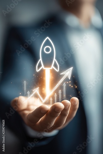 A business person holds a hand out with a rocket illustration glowing above it. The rocket appears as if it is launching, showing progress with arrows going up
