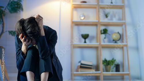 Принти на полотні A middle-aged woman feeling down in a dark room