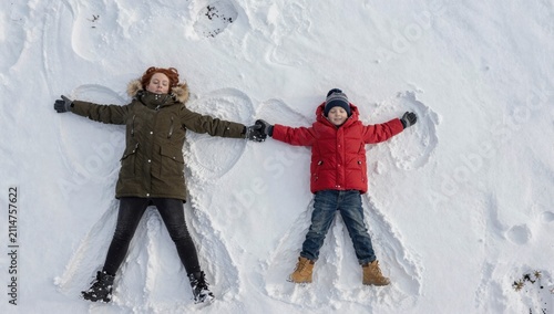 happy family playing in snow