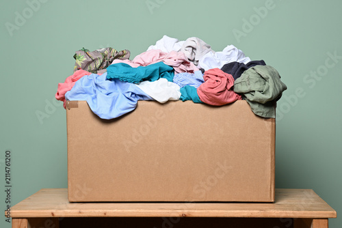 Cardboard box with various clothes