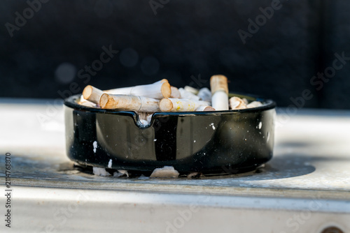 An ashtray full of stubbed out cigarettes