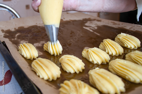 The process of making profiteroles. Homemade pastries.