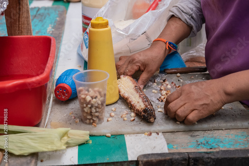 Roasted Corn Preparation at a Traditional Mexican Street Food Stall