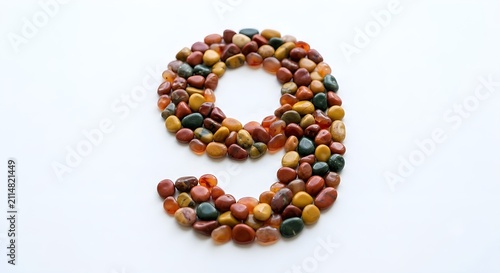 Number made of tiny mosaic stones on a white background
