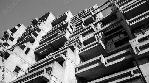 Upward view of modernist concrete building with geometric forms