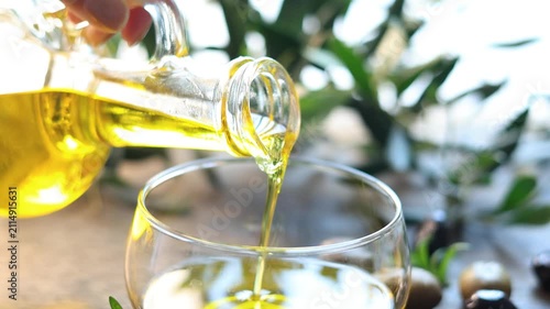 olive oil pouring in a glass bowl	
