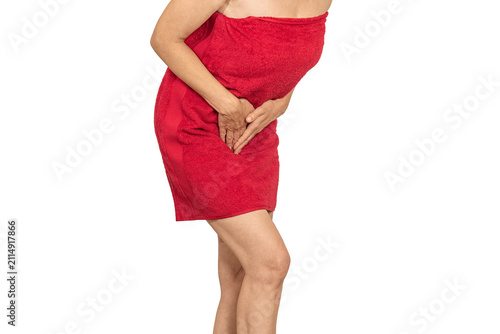 Female holding pelvic area in pain after shower, intimate health and bladder problem concept.
