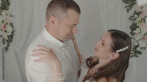 A couple in love, a man and a woman, hug and kiss.