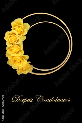 фотографія Deepest condolences floral funeral memorial tribute card on black background, wooden frame with yellow rose flowers