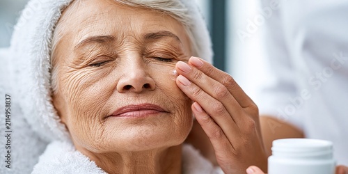 Senior woman enjoying rejuvenating facial skincare routine