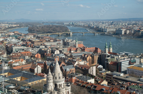 High angle cityscape of Budapest featuring Danube River and Hungarian Parliament seen from Matthias Church tower in Budapest, Hungary