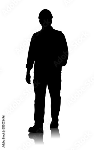 Full length black silhouette of a construction worker wearing a protective hard hat, standing upright isolated on a white background with soft floor reflection and ample copy space