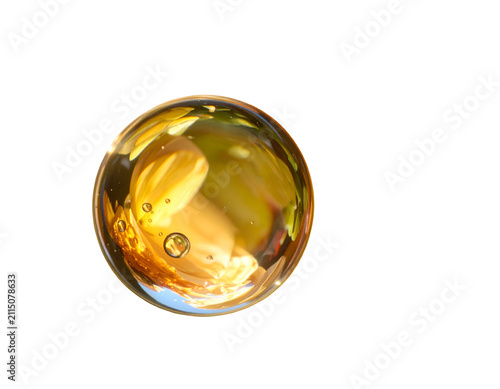 Refractive glass sphere with distorted flower reflection on black background