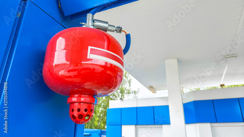 Konstfotografi Fire extinguisher mounted at a gas station