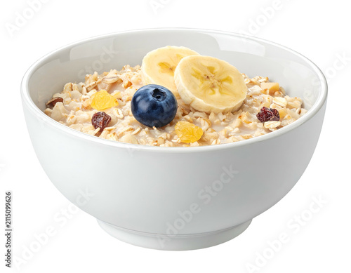 Bowl of Nutritious Oatmeal Porridge with Banana and Berries on Black Background