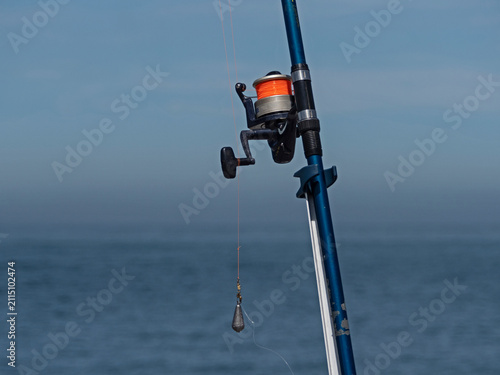Close-up shot of a large fishing rod with a sinker
