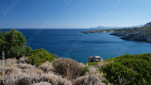 Canvastavla Rocky Coastline with Mediterranean Scrubland and Deep Blue Aegean Sea near Kalit