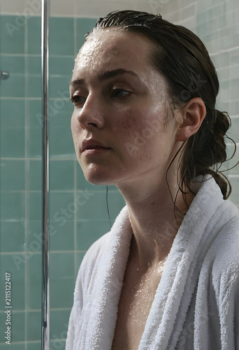 Young woman with wet hair a...