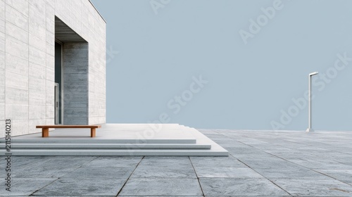 Minimalist stone building entrance with bench and lone lamp