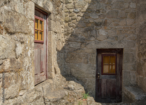 Rustic stone house with traditional wooden doors