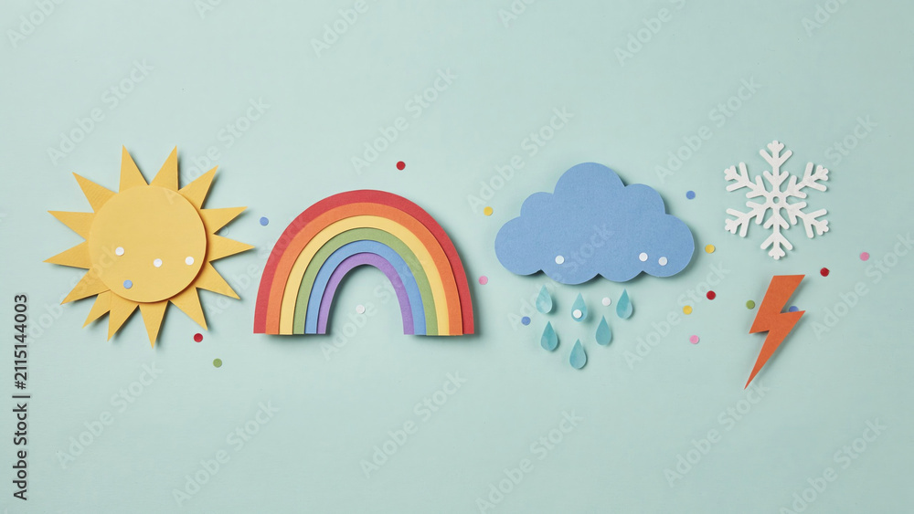 Obraz premium Colorful paper cutouts of weather symbols including sun, rainbow, rain cloud, snowflake, and lightning bolt on a blue background