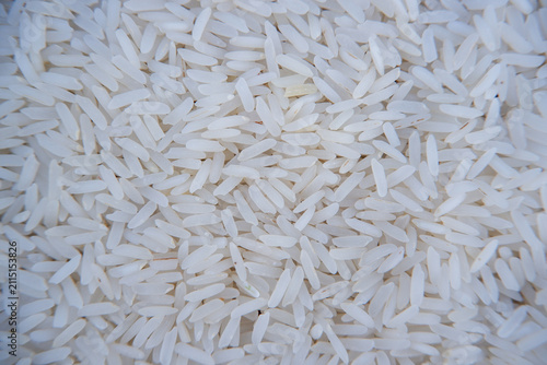 Full frame texture background of raw white Jasmine rice grains