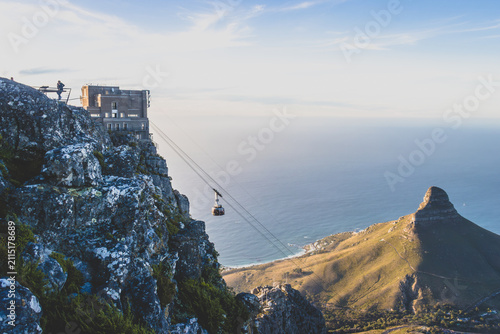 Cuadro en lienzo Cable car descending Table Mountain toward Lion's Head at golden hour, Cape Town