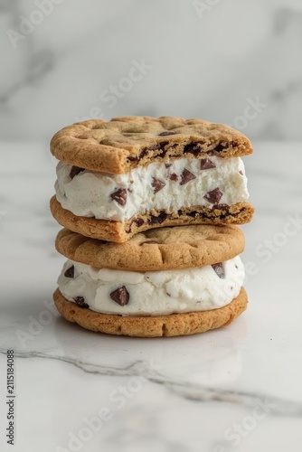Appetizing sandwiches made of round oat or shortbread cookies with pieces of chocolate, between which a thick layer of delicate vanilla ice cream with chocolate chips is laid.