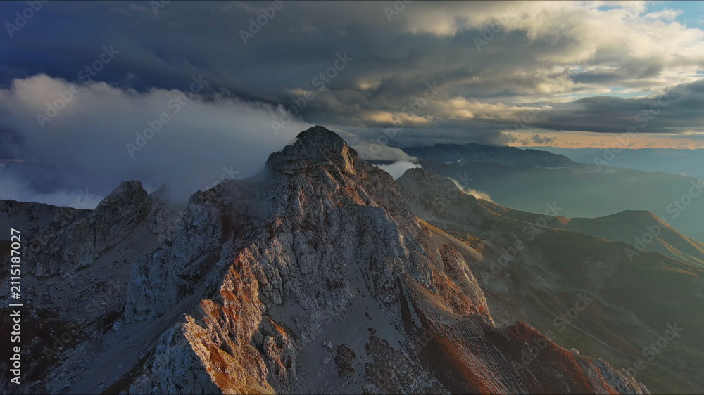 Obraz premium Aerial view of amazing rocky mountains at sunset