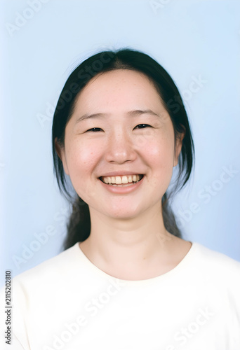 Smiling young asian woman w...
