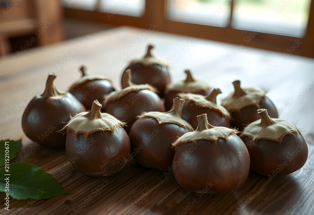 Obraz premium Group of artificial brown acorns with fabric caps and green leaves on a rustic wooden table, Autumn decoration