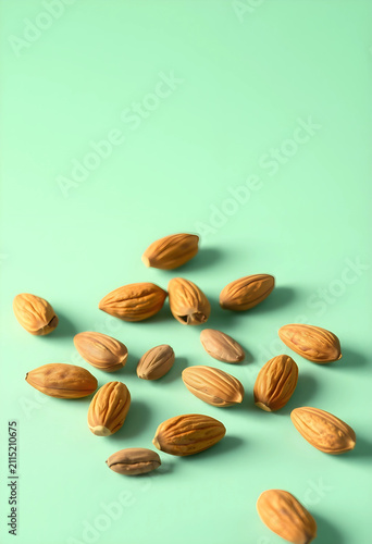 Jojoba seeds scattered on a...