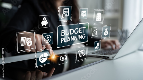 Bild auf Leinwand Detailed Budget Planning Concept with Finances and Graphs Depicted on a Modern Laptop Screen in an Office Setting