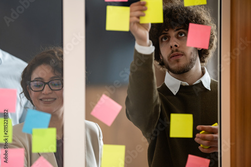 Team collaborating on creative brainstorming session with sticky notes
