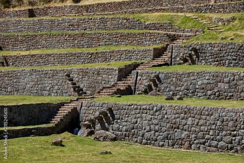 Bild auf Leinwand Massive stone terraces sweep across the hillside at Tipon, stepping down the mountainside in a display of Inca agricultural and hydraulic engineering rarely matched anywhere in the Andes
