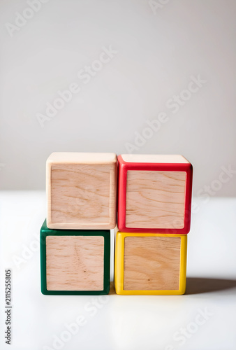 Four wooden toy blocks with...