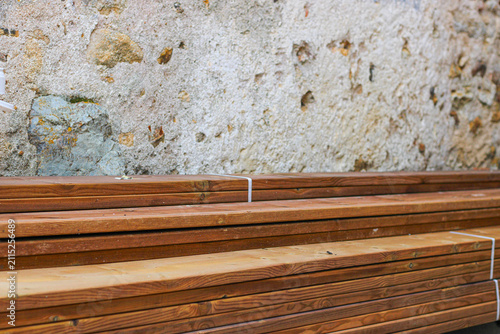 Stack of brown wooden planks, floor construction planks