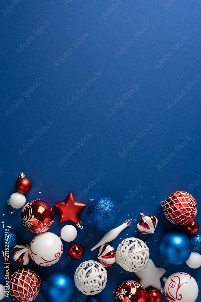 Obraz premium Merry Christmas and Happy New Year blue background with red white and vertical blue festive ornaments