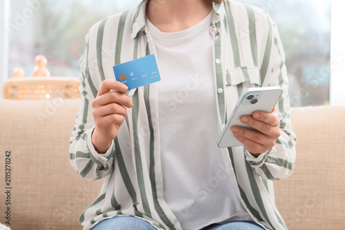 Woman with credit card and ...